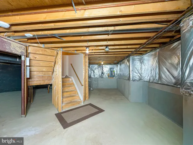 a view of an empty room with stairs