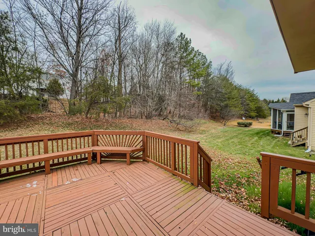 a view of deck with wooden floor and fence