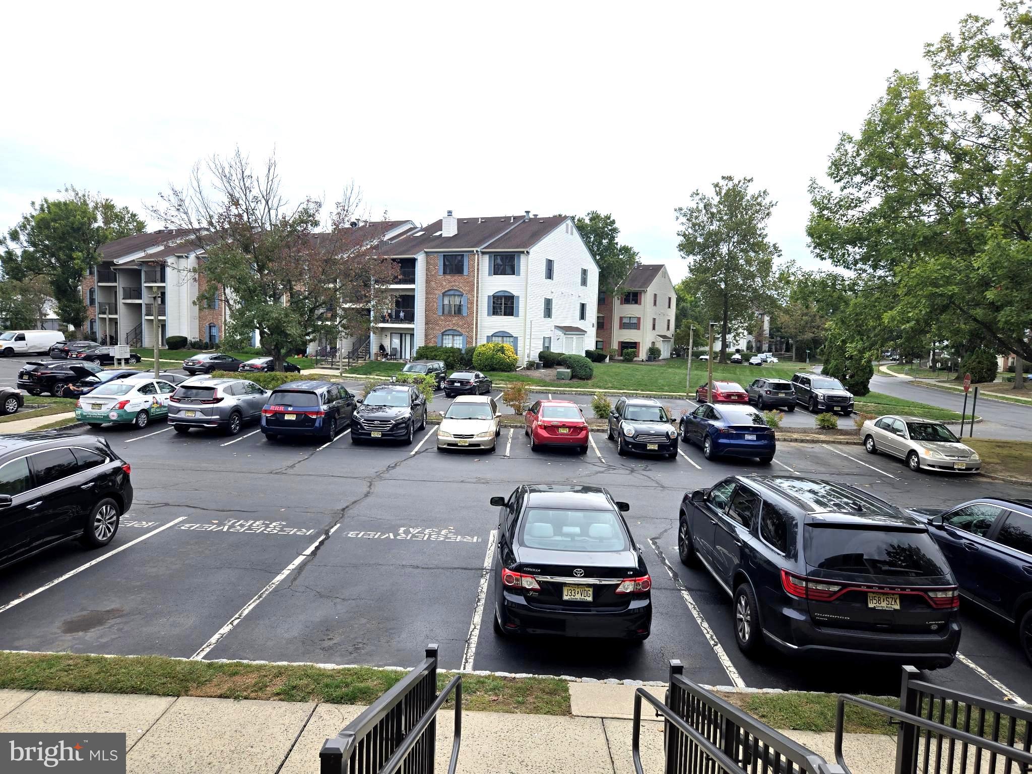 13 Voscek Court Lawrence Township, NJ 08648 - Photo 1 of 13 a car parked in front of a building