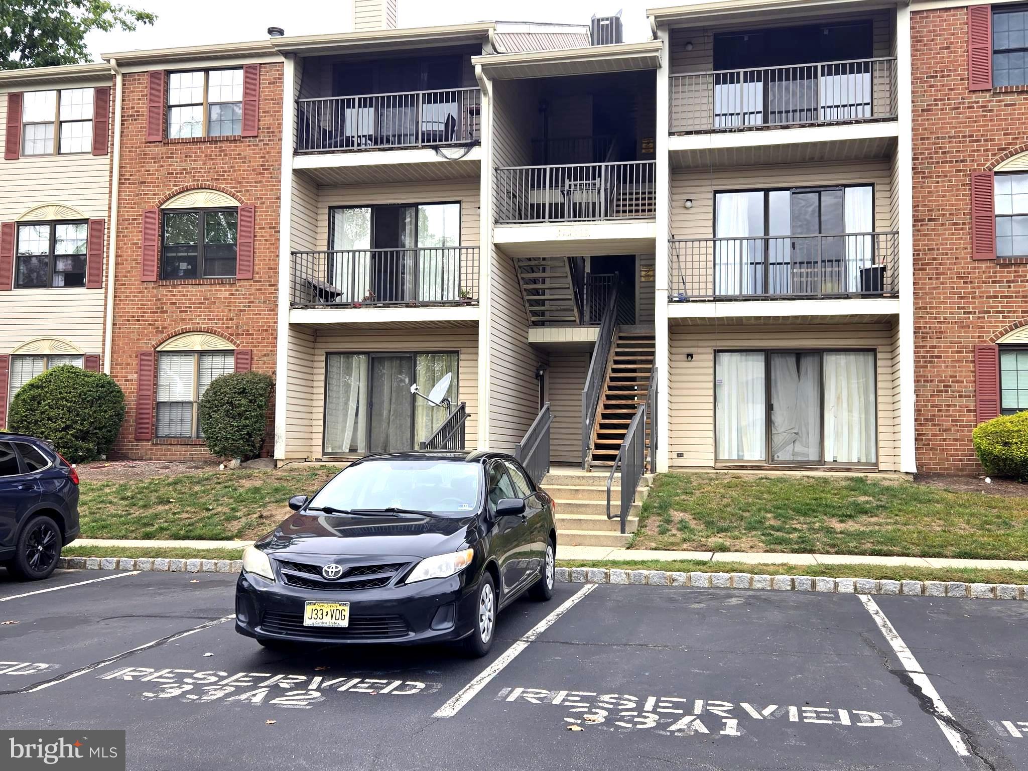 13 Voscek Court Lawrence Township, NJ 08648 - Photo 2 of 13 a front view of a house with a yard