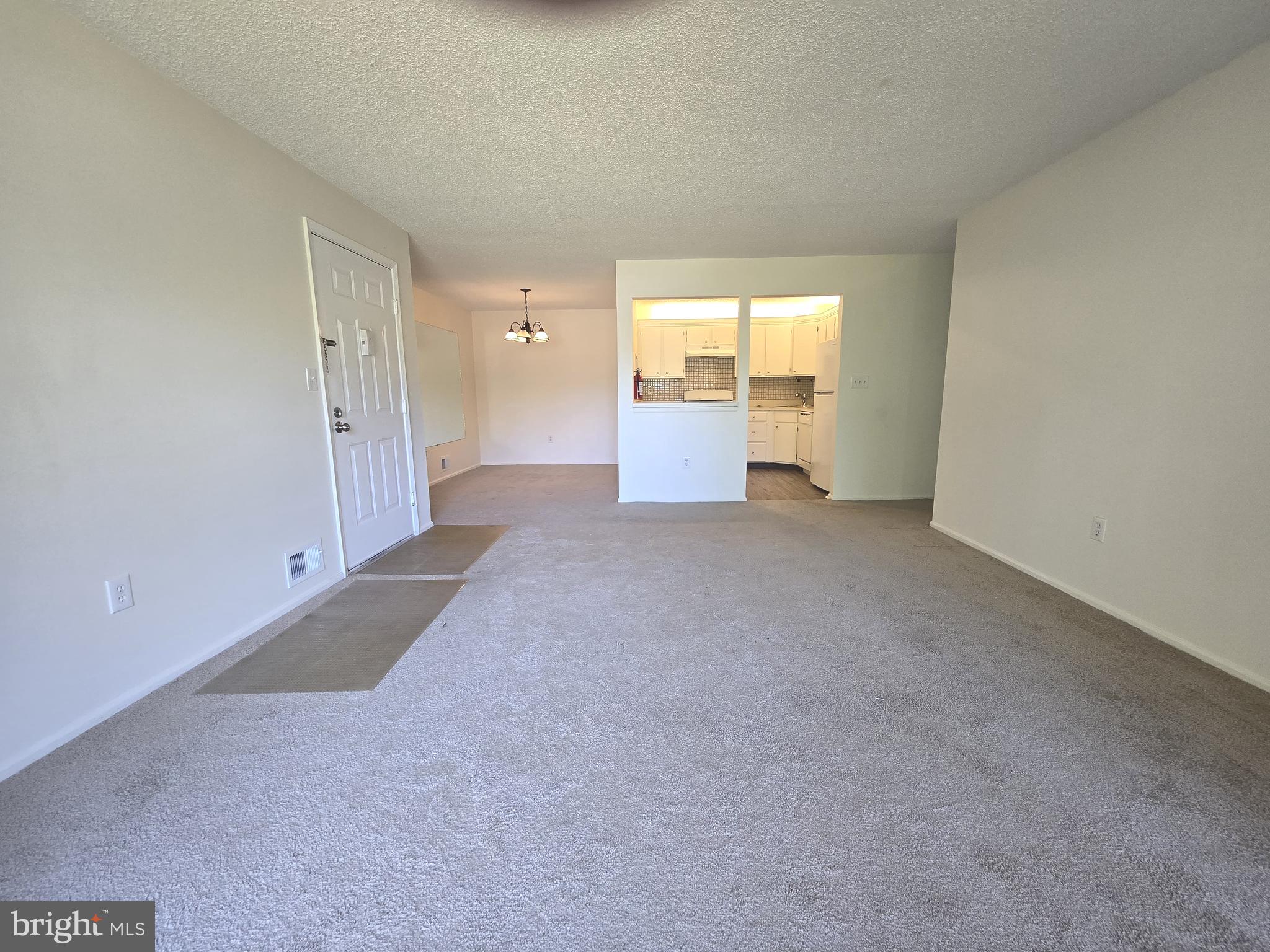 13 Voscek Court Lawrence Township, NJ 08648 - Photo 3 of 13 a view of a big room with windows and cabinet