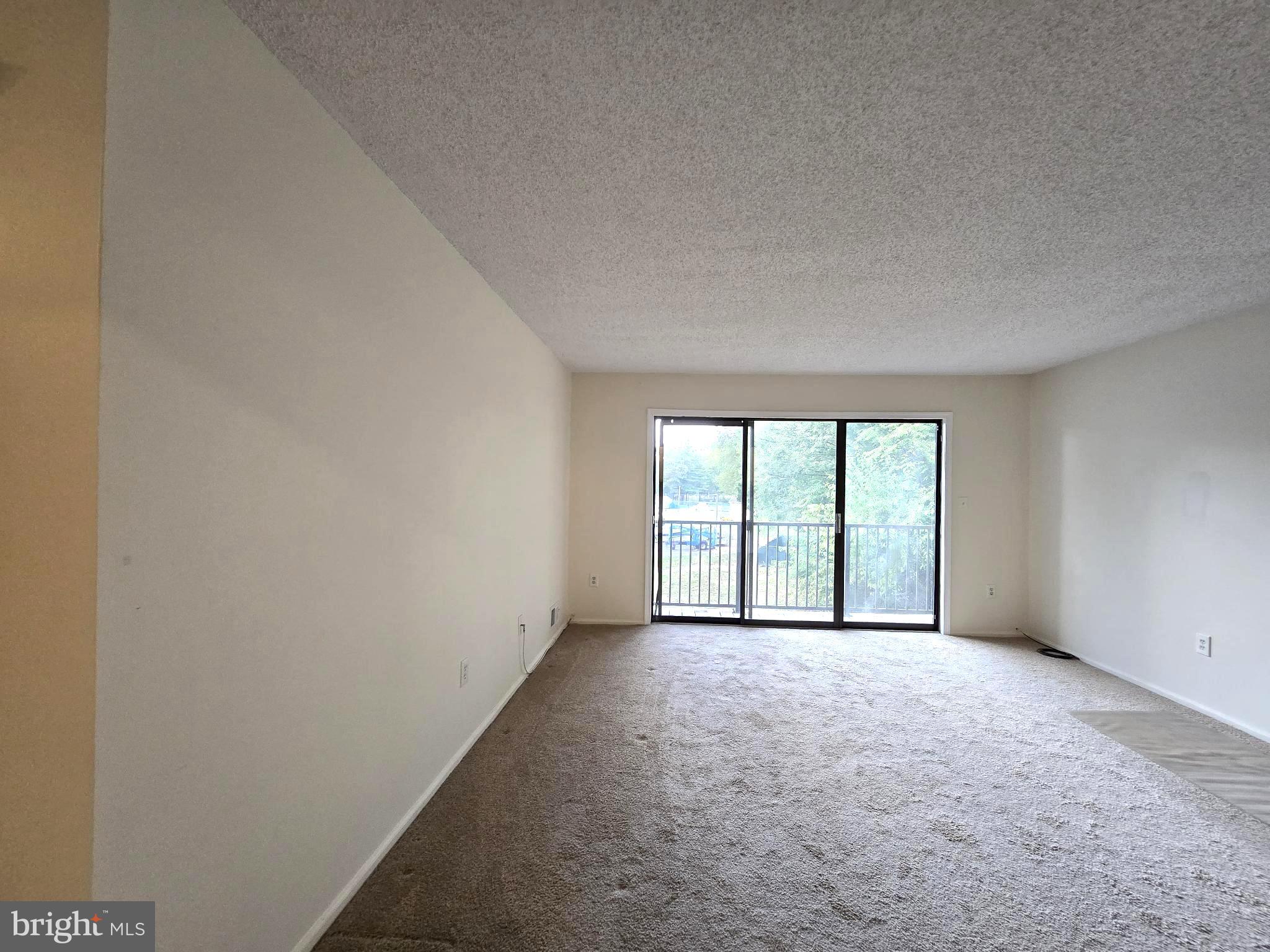 13 Voscek Court Lawrence Township, NJ 08648 - Photo 7 of 13 a view of an empty room with a window