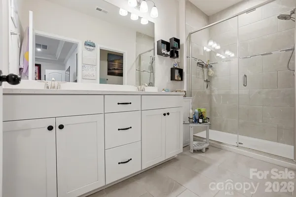 a spacious bathroom with a double vanity sink mirror and