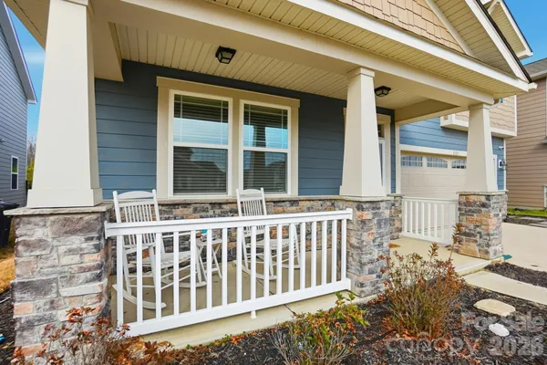 a front view of a house with a porch