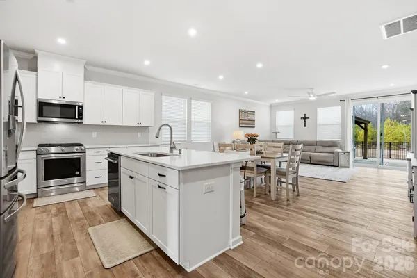 a kitchen with cabinets a sink and appliances