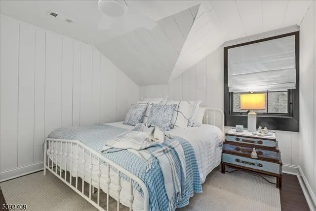 an aerial view of a house with a lake view