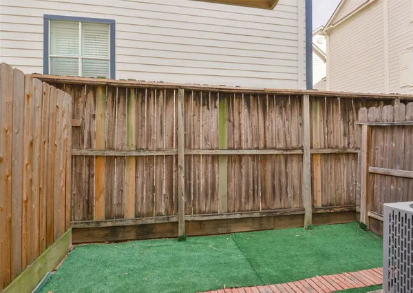 a bathroom with a granite countertop tub sink and mirror