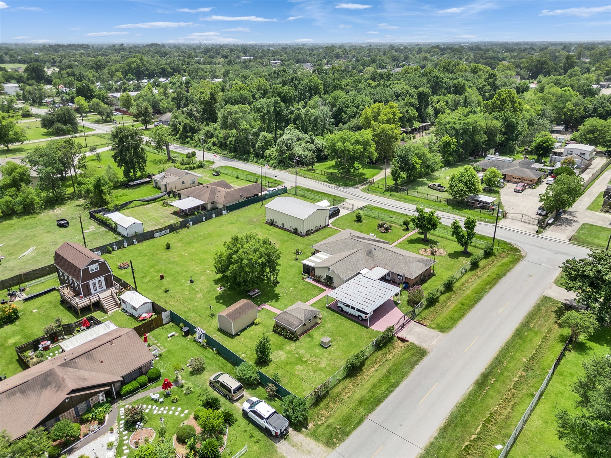 14310 Henry Road Houston, TX 77060 - Photo 4 of 34 Discover your dream home from an aerial view, showcasing a spacious property surrounded by lush greenery and serene neighborhood charm, perfect for tranquil living.