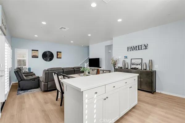 a kitchen with kitchen island a white counter top space