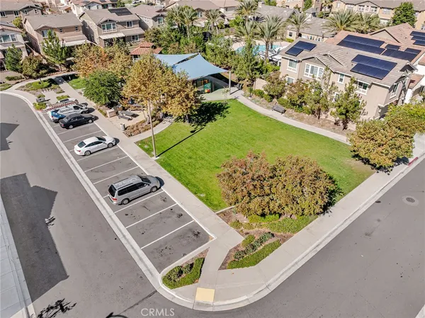 an aerial view of a residential houses with outdoor space