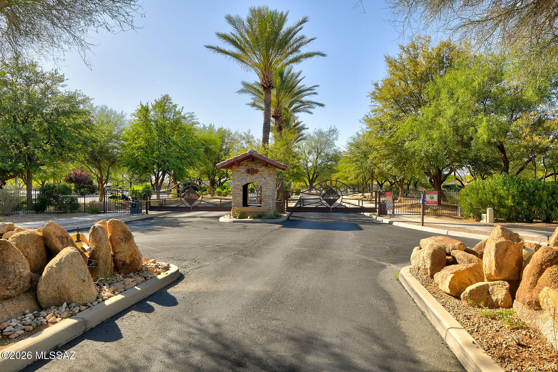 13991 East Cheavront Loop Vail, AZ 85641 - Photo 47 of 47 a swimming pool with outdoor seating and trees in the background