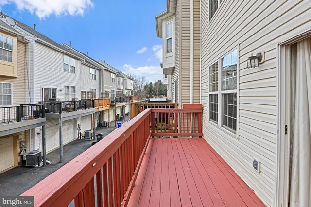 a view of a house with wooden deck