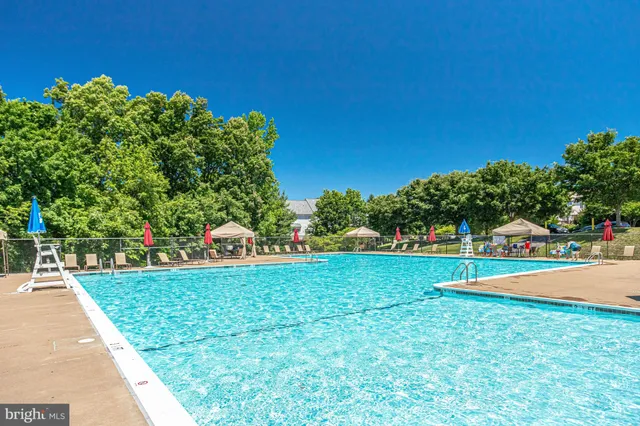 a view of a garden and front view of a house