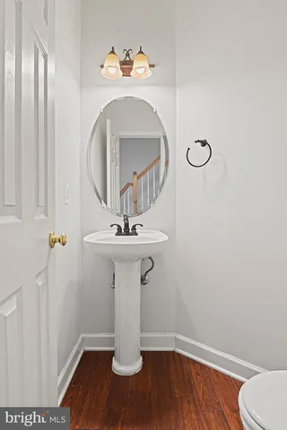 a bathroom with a sink and mirror