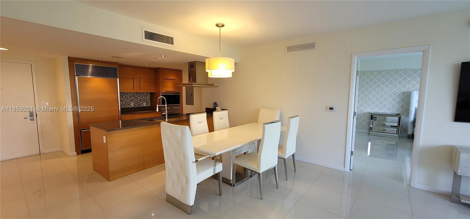 495 Brickell Avenue, Unit 420 Miami, FL 33131 - Photo 12 of 73 a living room with furniture a dining table and chairs