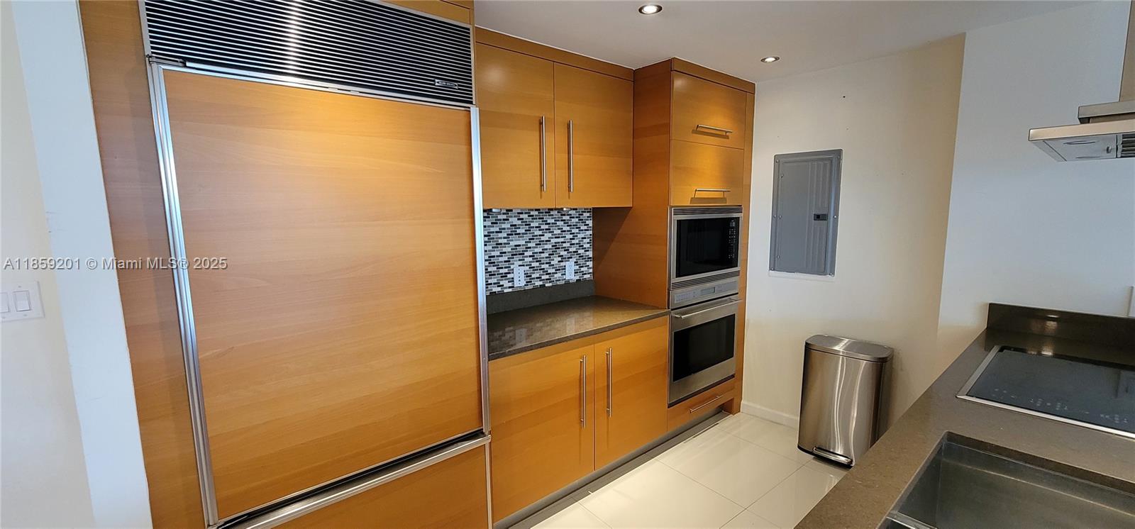 495 Brickell Avenue, Unit 420 Miami, FL 33131 - Photo 15 of 73 a kitchen with stainless steel appliances granite countertop a refrigerator and a stove