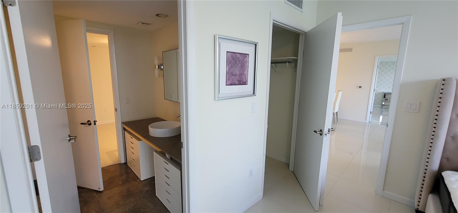 495 Brickell Avenue, Unit 420 Miami, FL 33131 - Photo 19 of 73 a bathroom with a granite countertop sink