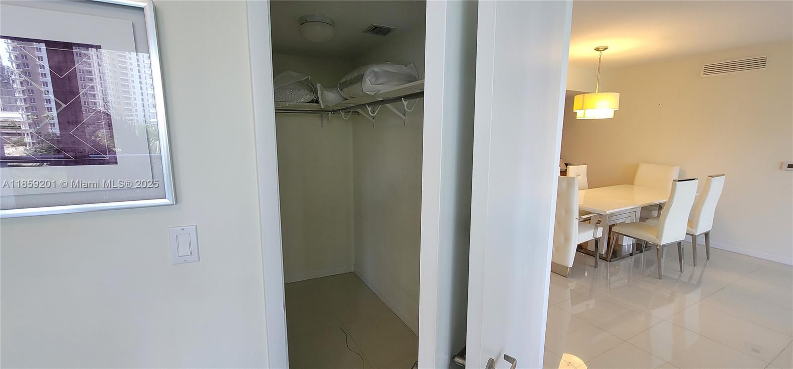495 Brickell Avenue, Unit 420 Miami, FL 33131 - Photo 20 of 73 a view of a hallway with furniture and a gate