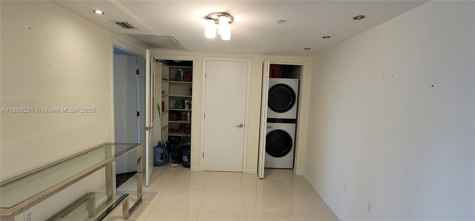 495 Brickell Avenue, Unit 420 Miami, FL 33131 - Photo 24 of 73 a view of a storage & utility room with washer and dryer