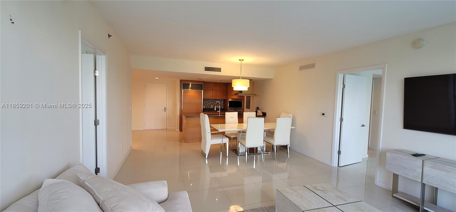 495 Brickell Avenue, Unit 420 Miami, FL 33131 - Photo 25 of 73 a living room with furniture and a flat screen tv