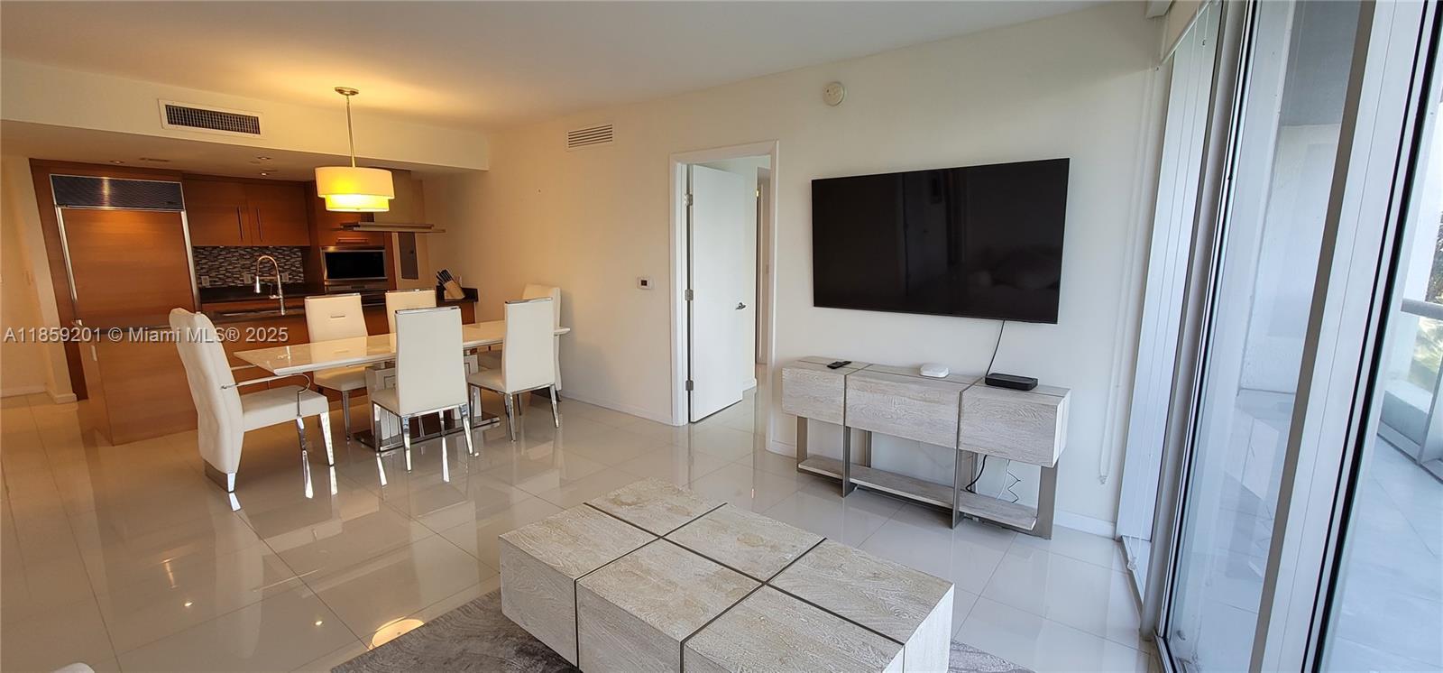 495 Brickell Avenue, Unit 420 Miami, FL 33131 - Photo 26 of 73 a view of a livingroom with furniture and a flat screen tv