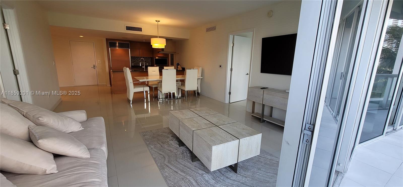 495 Brickell Avenue, Unit 420 Miami, FL 33131 - Photo 28 of 73 a living room with furniture and a flat screen tv