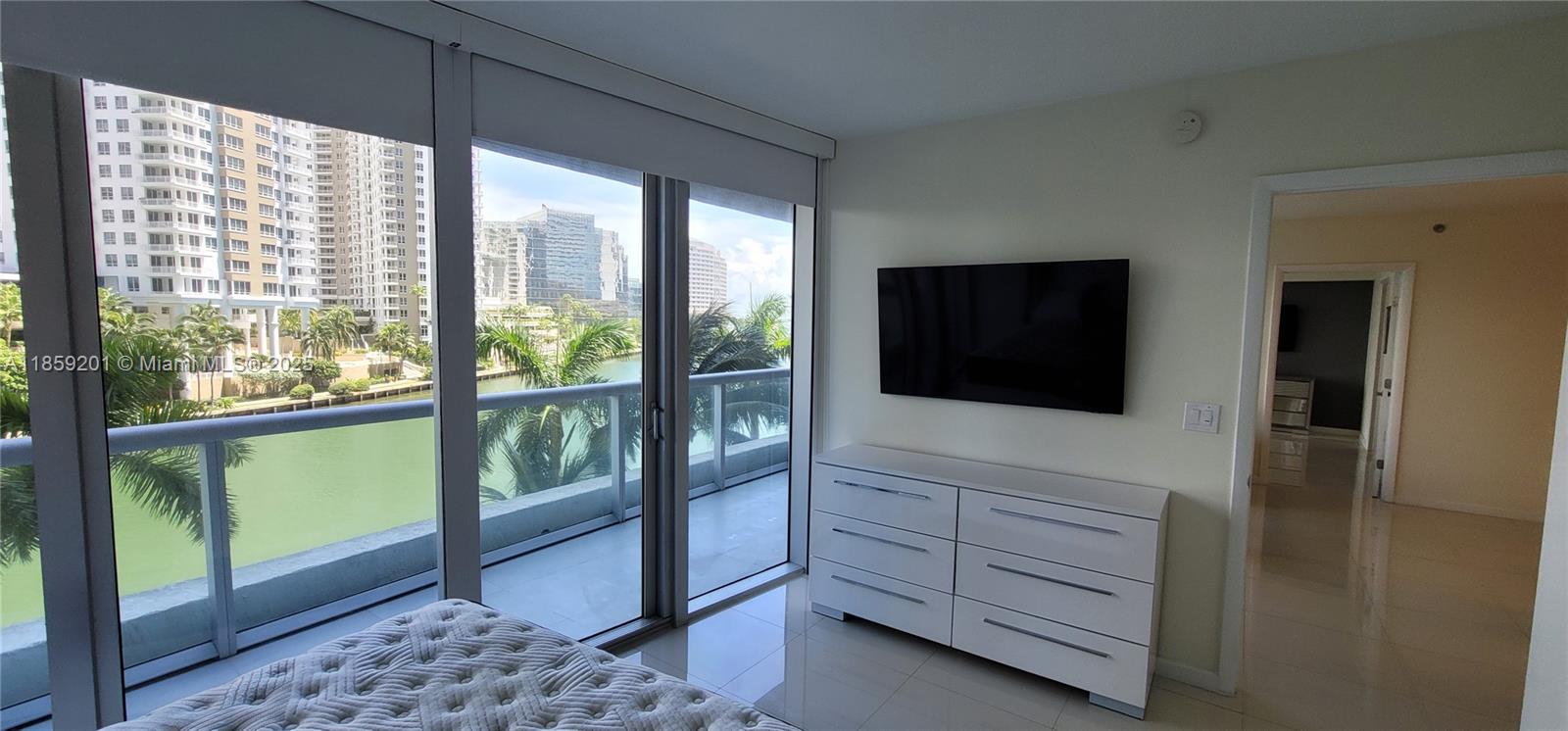 495 Brickell Avenue, Unit 420 Miami, FL 33131 - Photo 32 of 73 a living room with furniture and a flat screen tv