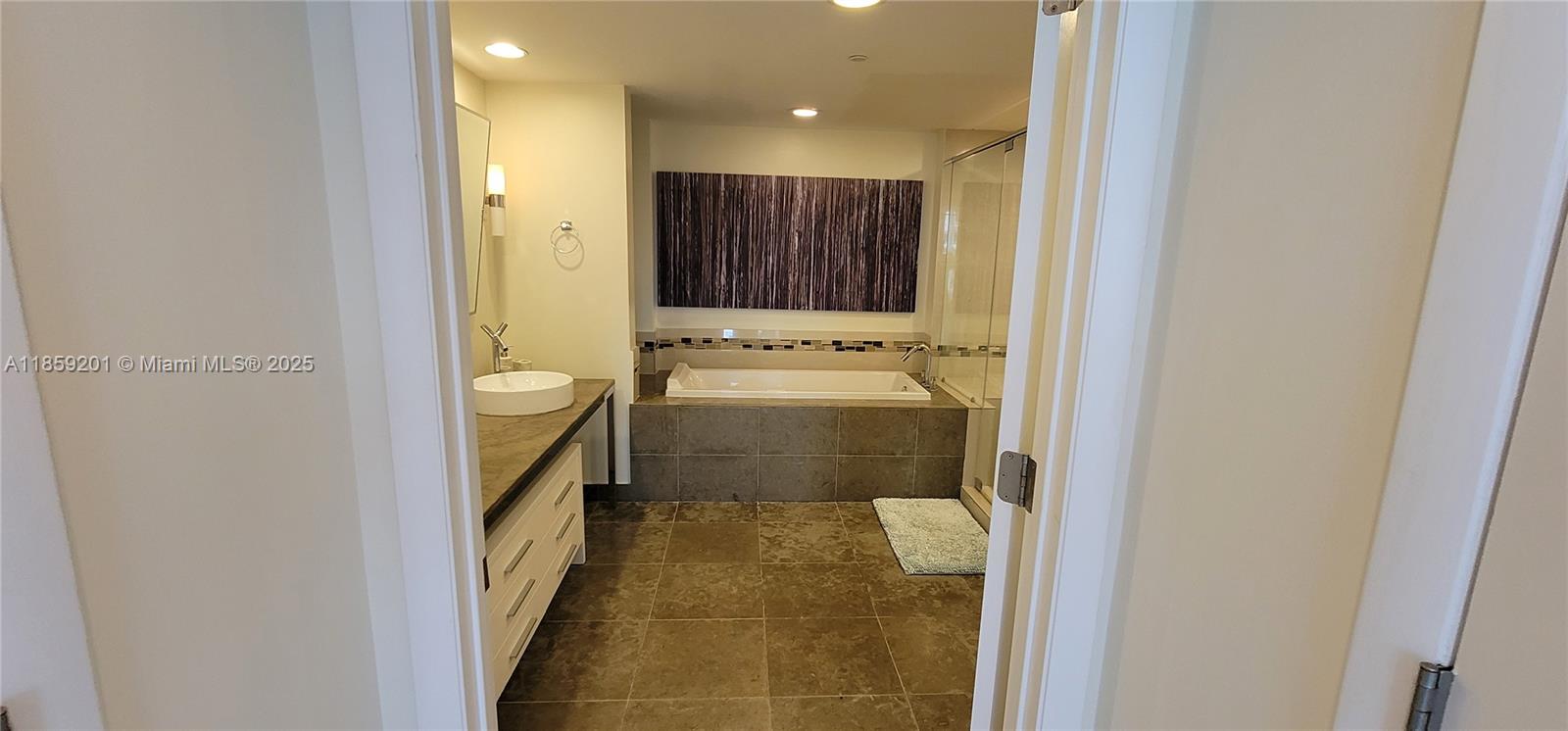 495 Brickell Avenue, Unit 420 Miami, FL 33131 - Photo 44 of 73 a bathroom with a sink a toilet and mirror