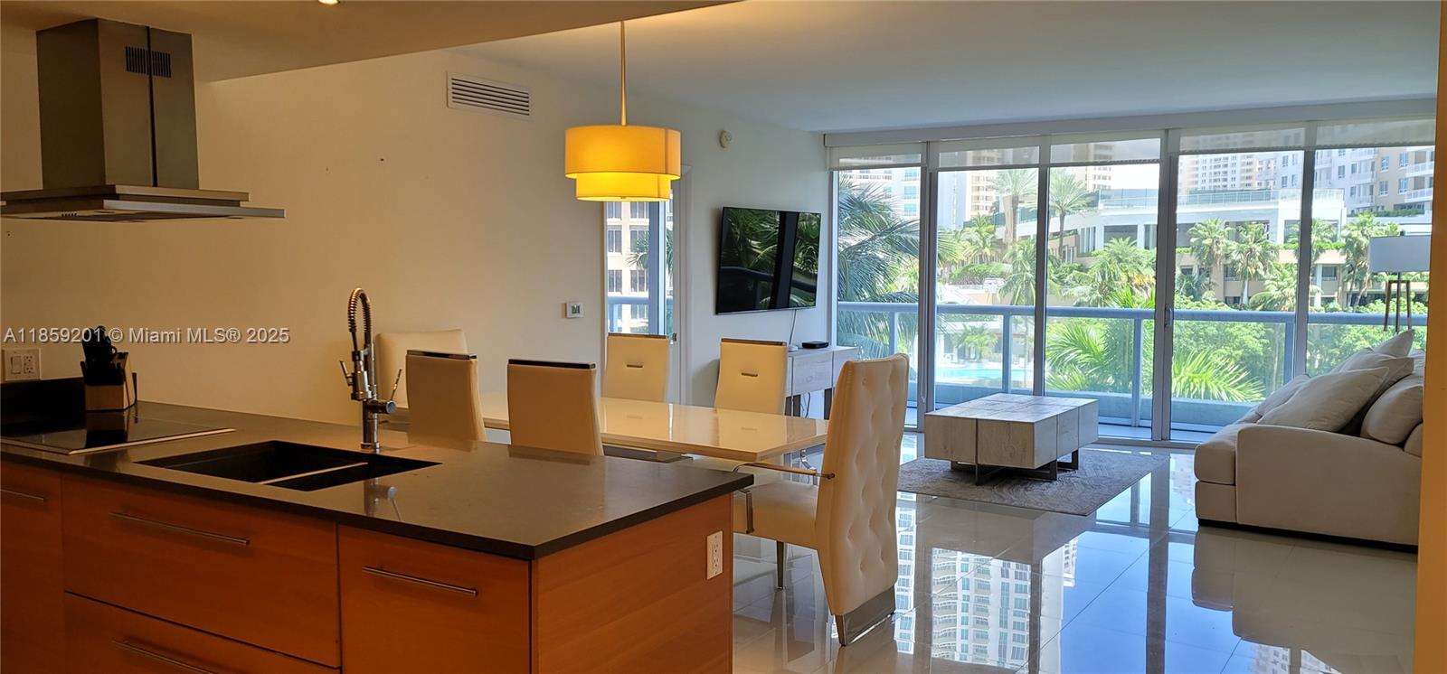 495 Brickell Avenue, Unit 420 Miami, FL 33131 - Photo 6 of 73 a living room with furniture and a floor to ceiling window