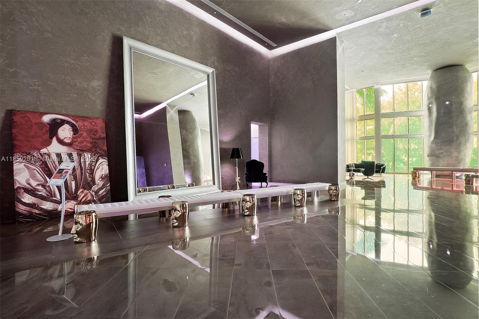 495 Brickell Avenue, Unit 420 Miami, FL 33131 - Photo 72 of 73 a lobby with furniture and floor to ceiling window