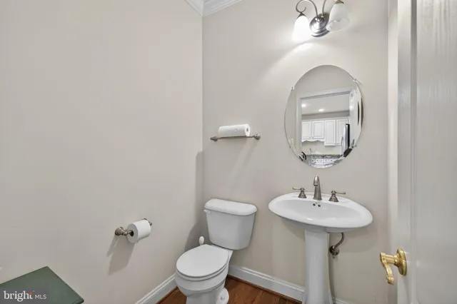 a living room with granite countertop furniture and wooden floor