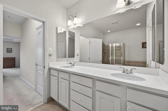 a bedroom with a bed and a television