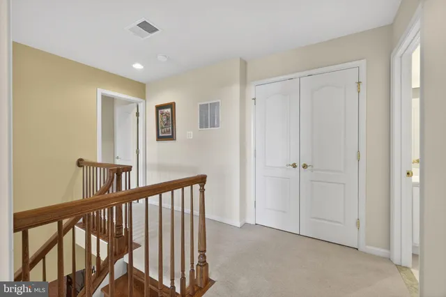 a bathroom with a toilet a sink a mirror a bathtub and shower