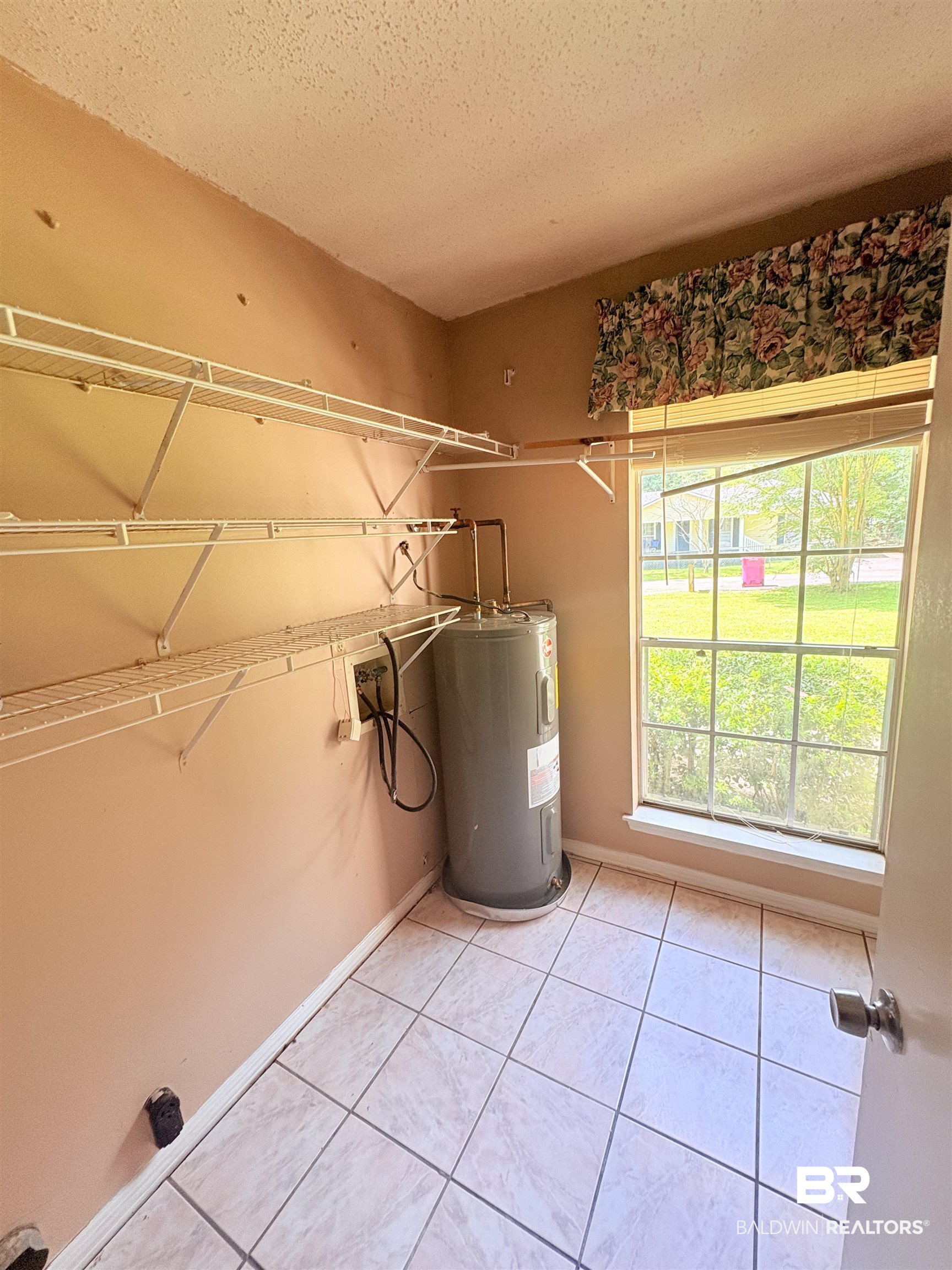 8070 Middle Ring Road Mobile, AL 36619 - Photo 22 of 26 Utility room with electric water heater