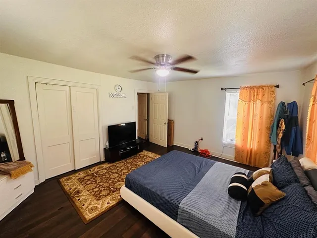 a bed room with a bed and a television