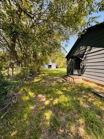 a view of a yard with an outdoor space