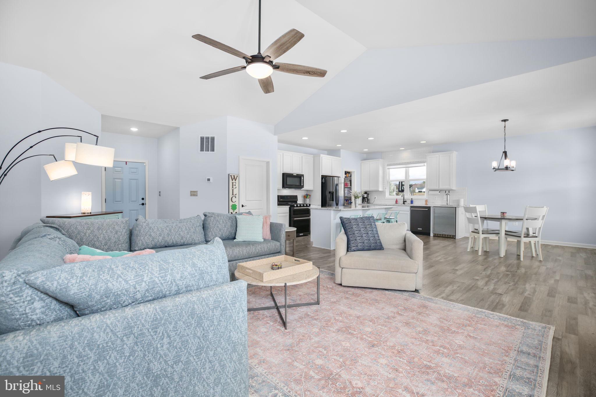 9564 Blackbird Loop Culpeper, VA 22701 - Photo 11 of 52 a living room with furniture and kitchen view