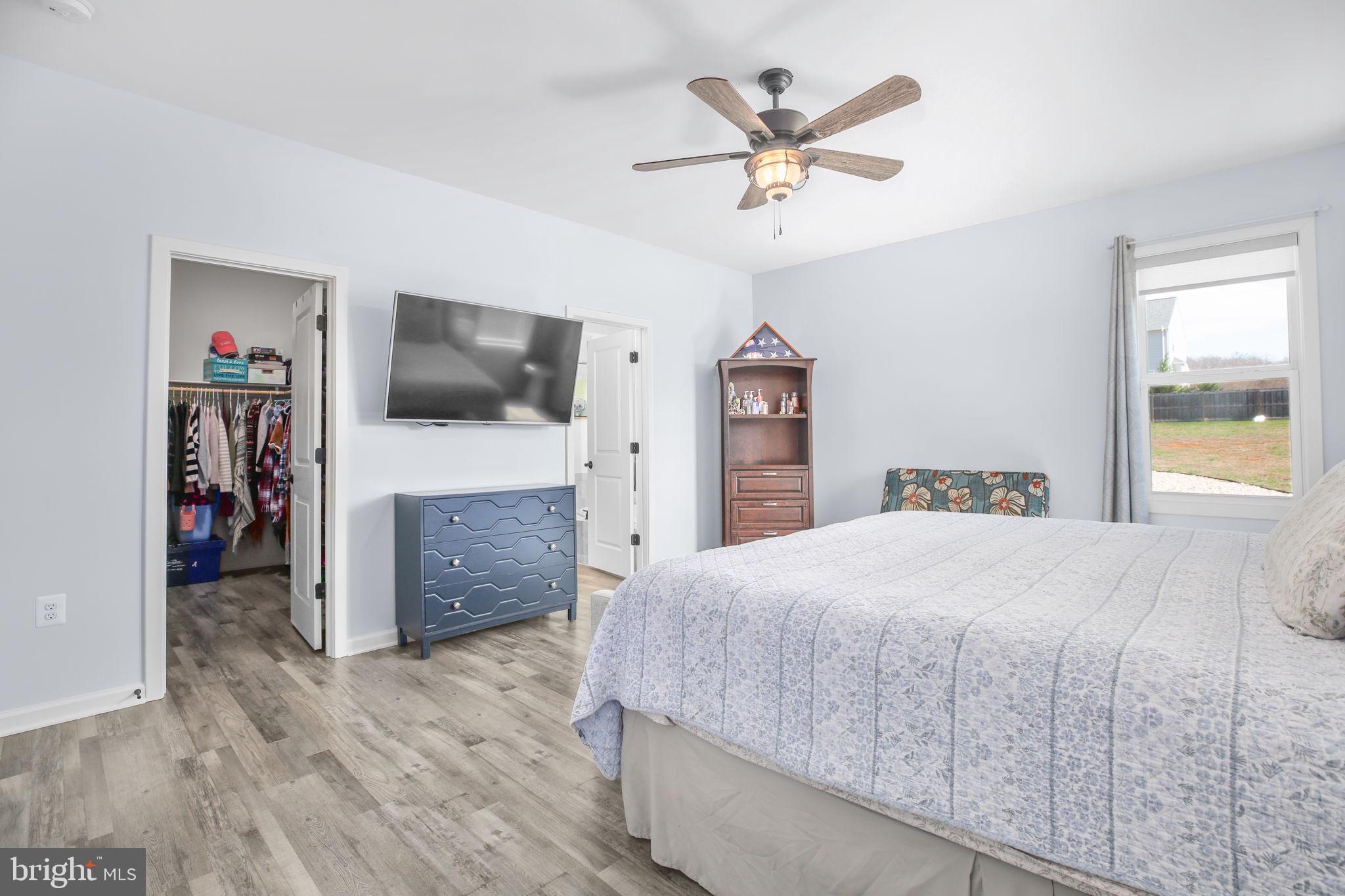9564 Blackbird Loop Culpeper, VA 22701 - Photo 15 of 52 a bedroom with a bed and a flat screen tv