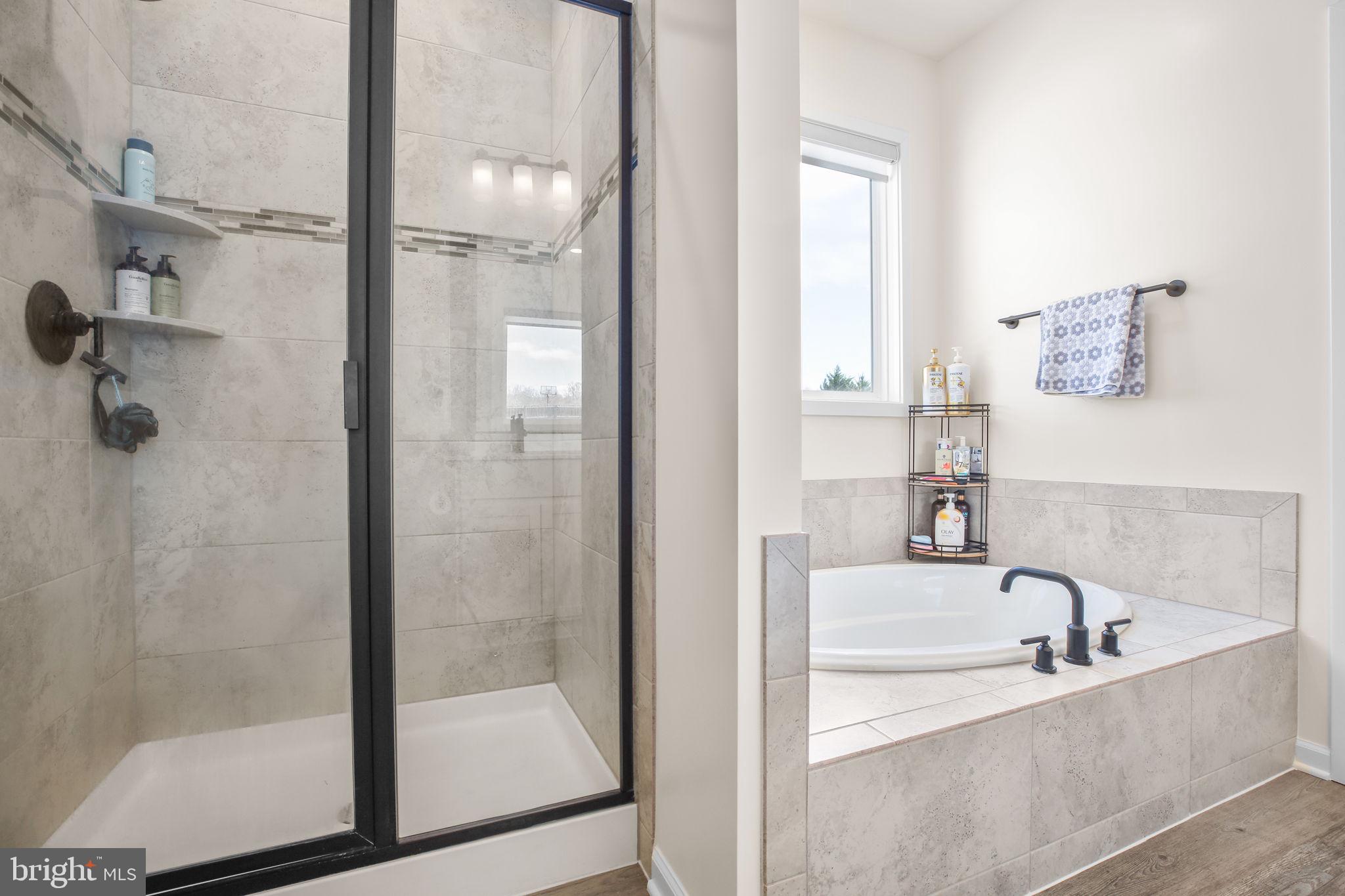 9564 Blackbird Loop Culpeper, VA 22701 - Photo 18 of 52 a bathroom with a bathtub and shower