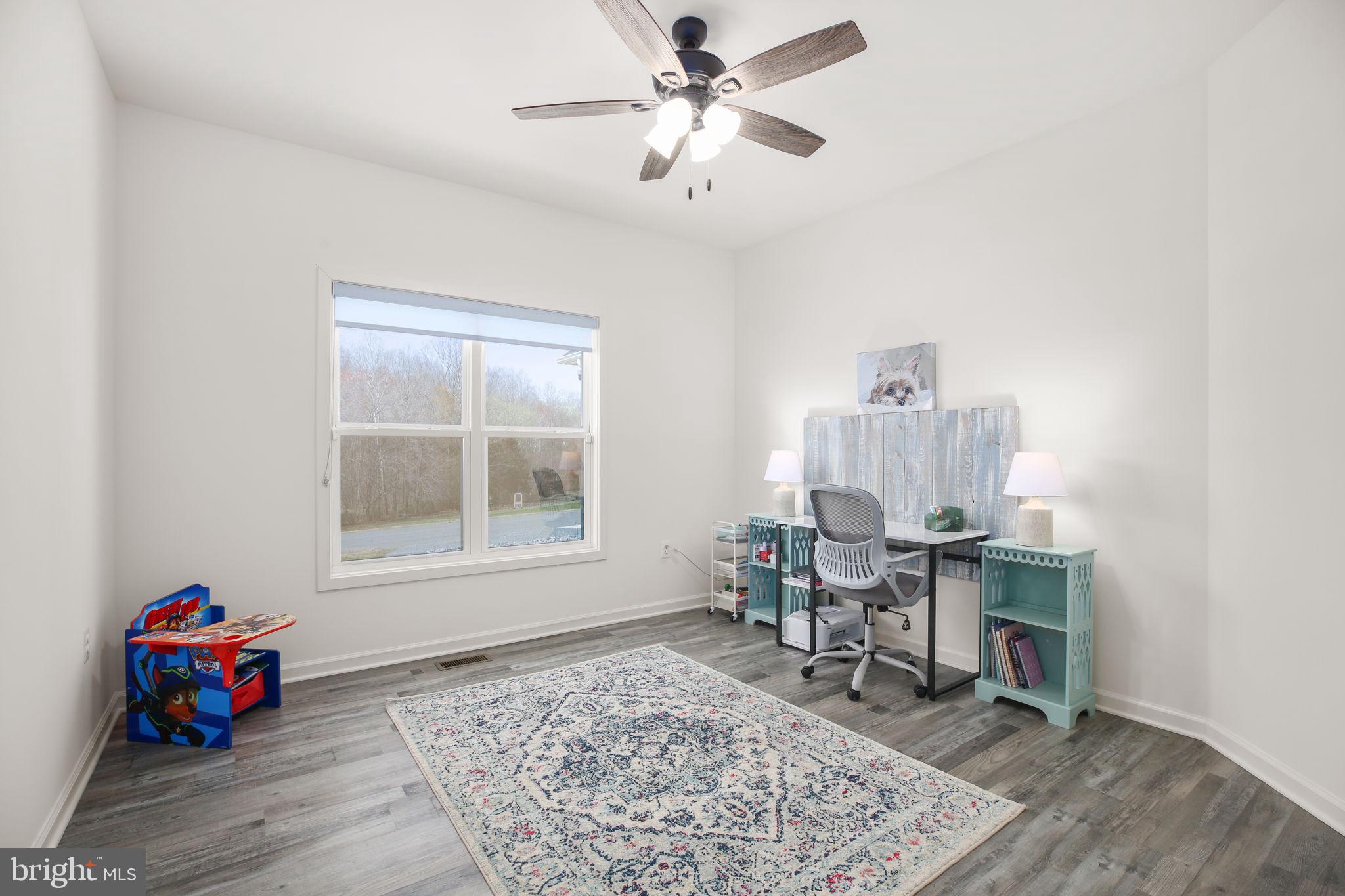 9564 Blackbird Loop Culpeper, VA 22701 - Photo 19 of 52 a living room with furniture and a window