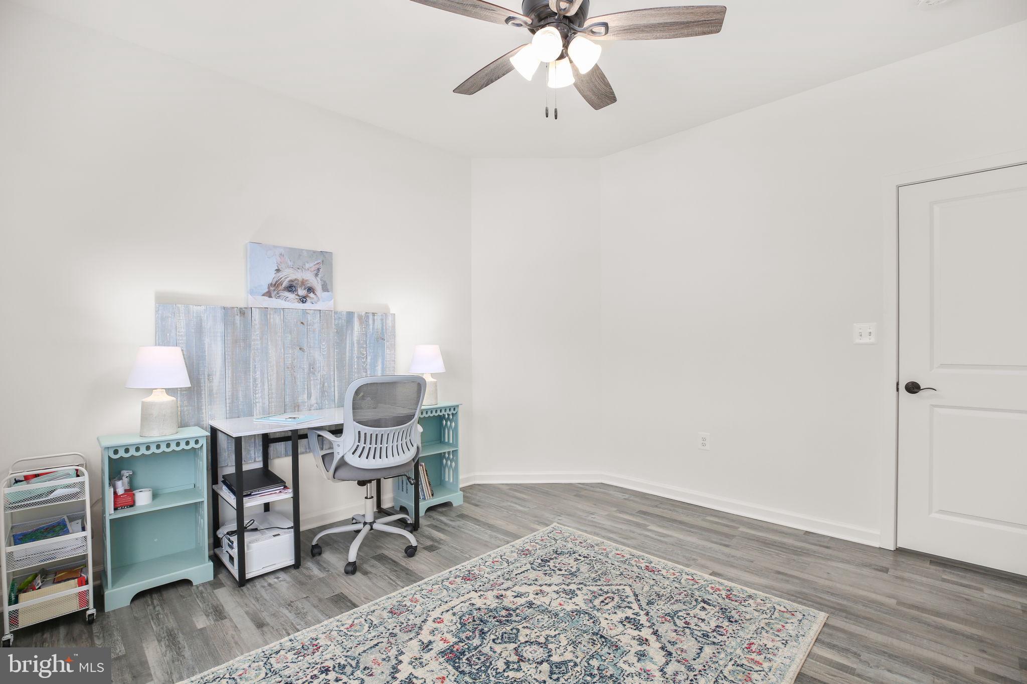9564 Blackbird Loop Culpeper, VA 22701 - Photo 20 of 52 a view of a workspace with furniture and wooden floor