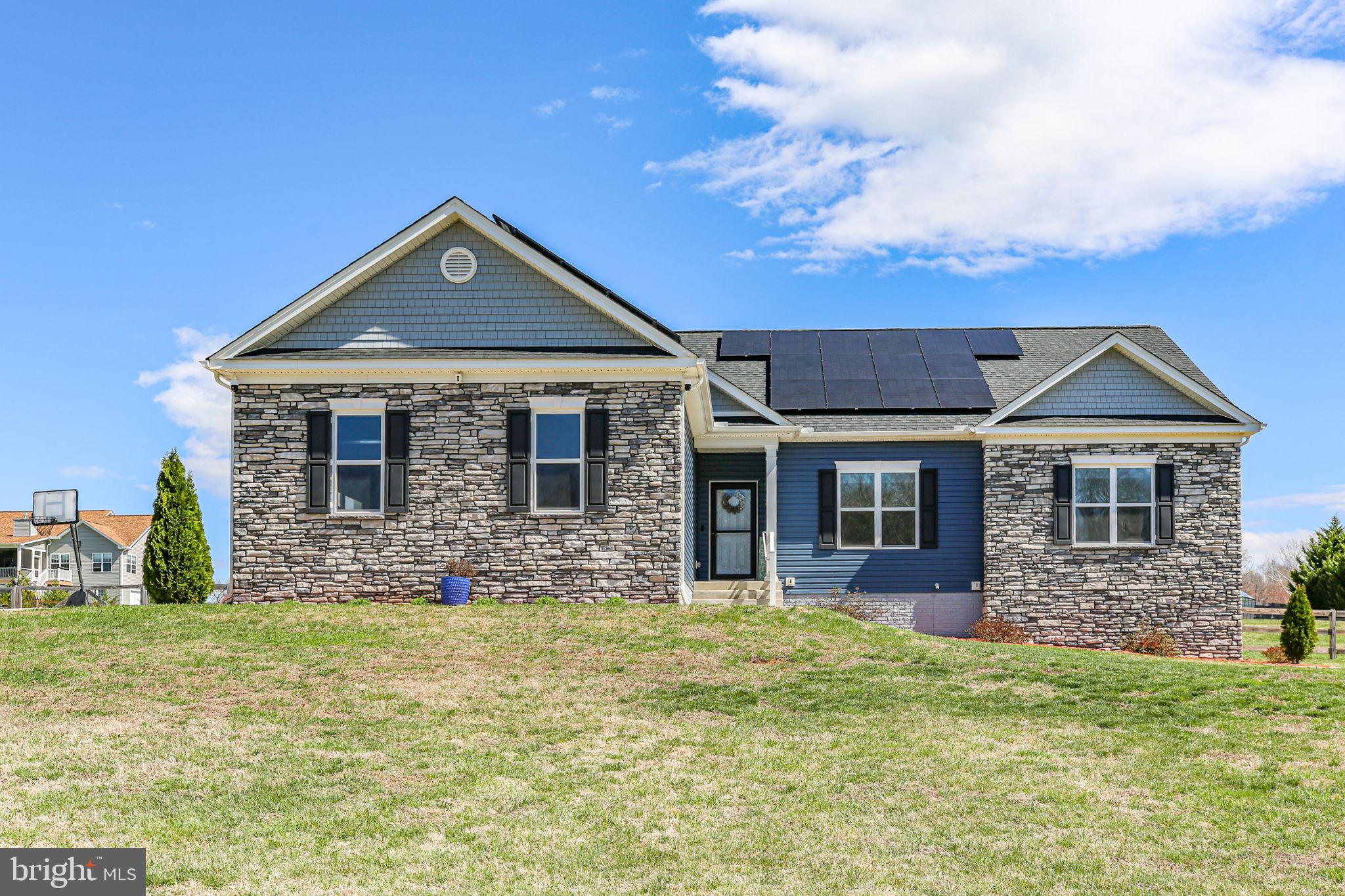 9564 Blackbird Loop Culpeper, VA 22701 - Photo 2 of 52 a front view of a house with a yard