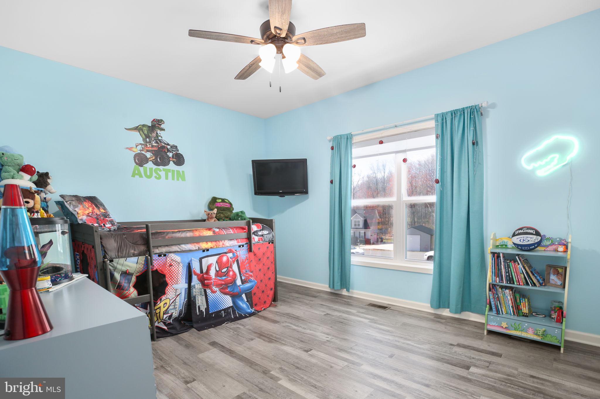9564 Blackbird Loop Culpeper, VA 22701 - Photo 21 of 52 a bed room with furniture and flat screen tv