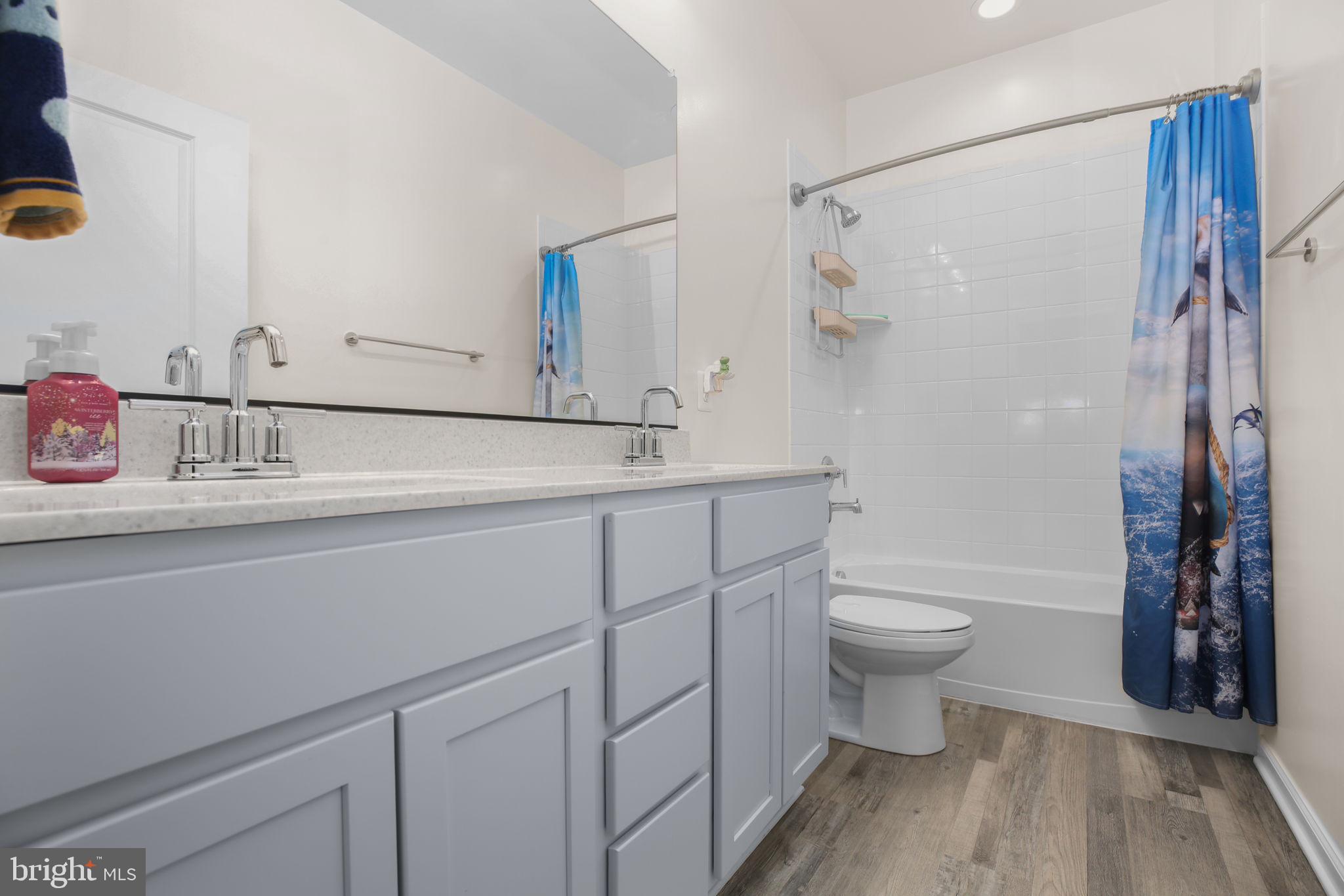 9564 Blackbird Loop Culpeper, VA 22701 - Photo 23 of 52 a bathroom with a sink toilet a shower and a mirror