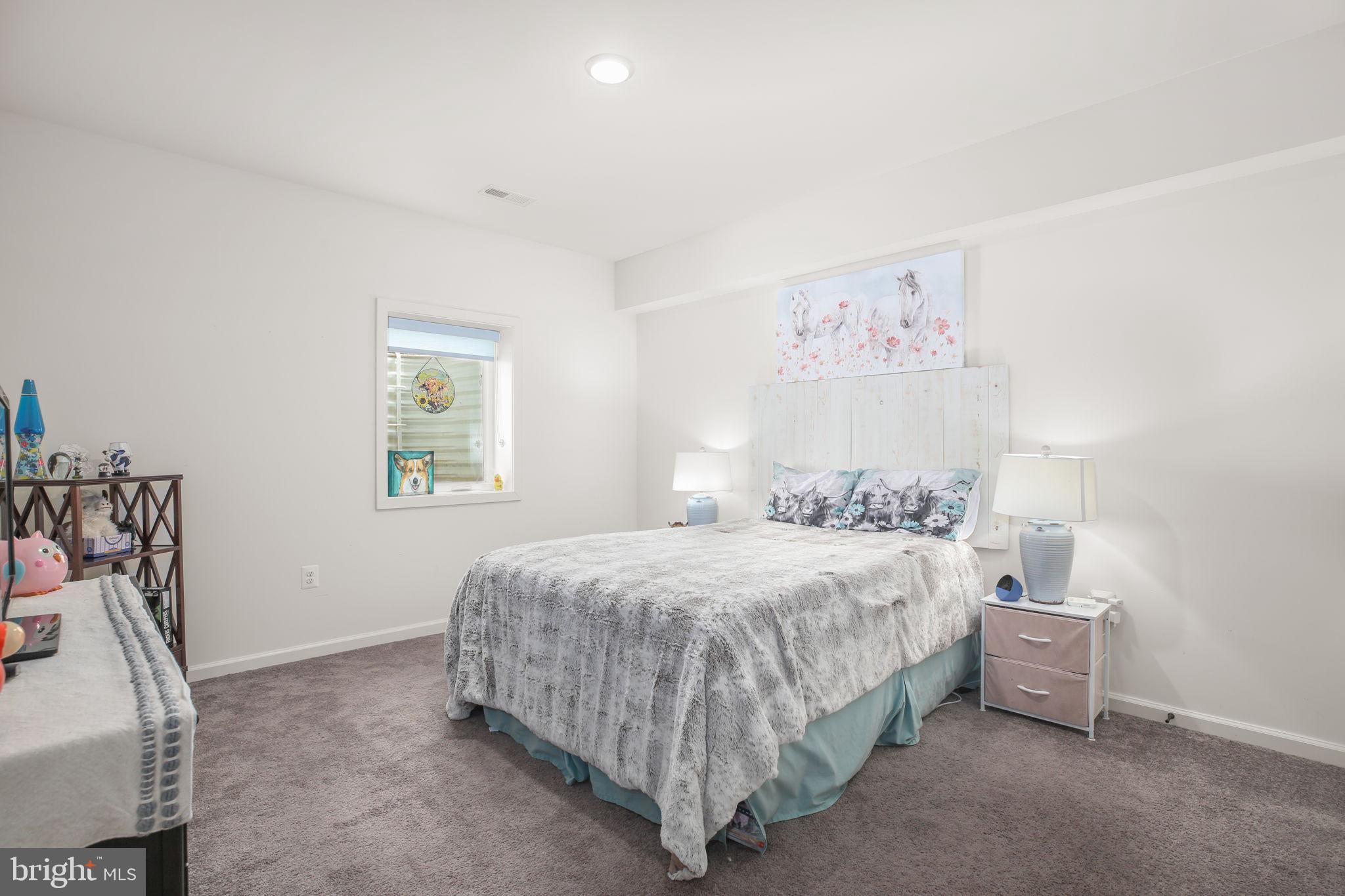 9564 Blackbird Loop Culpeper, VA 22701 - Photo 29 of 52 a bedroom with a bed and a window
