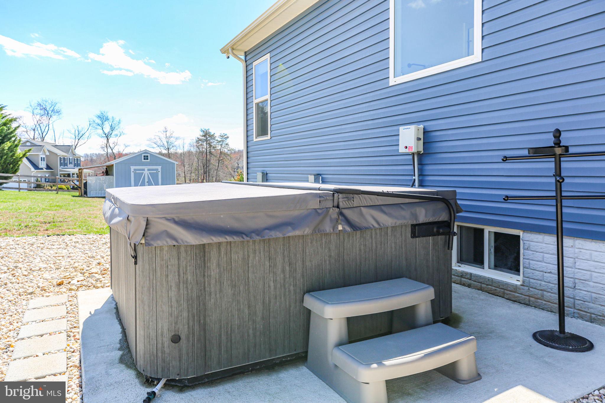 9564 Blackbird Loop Culpeper, VA 22701 - Photo 39 of 52 a view of a patio with a table and chairs