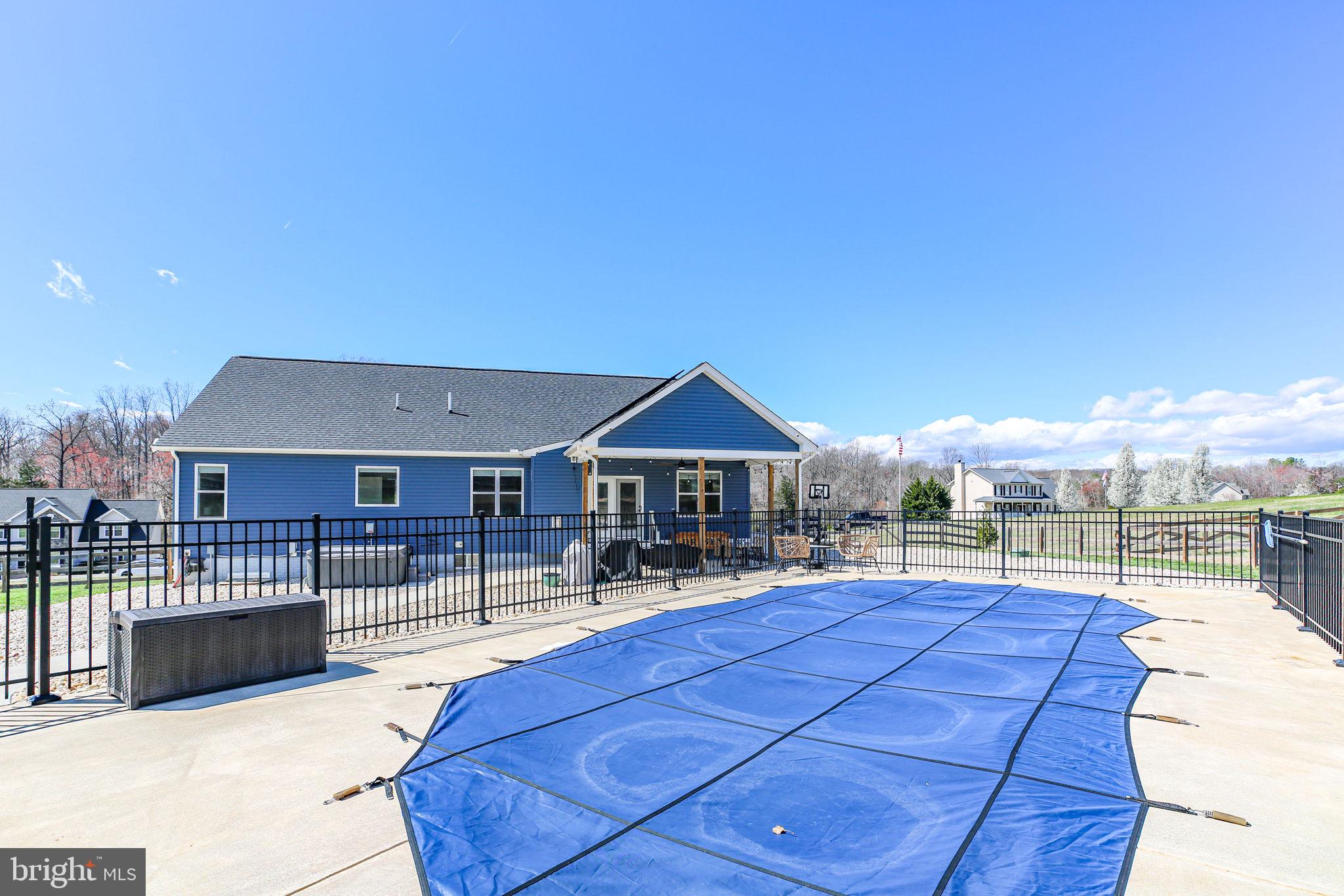 9564 Blackbird Loop Culpeper, VA 22701 - Photo 43 of 52 a swimming pool with outdoor seating and yard