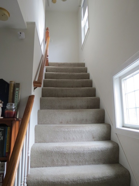 30 Harvard Road Shirley, MA 01464 - Photo 11 of 28 a view of staircase with lots of frames on wall