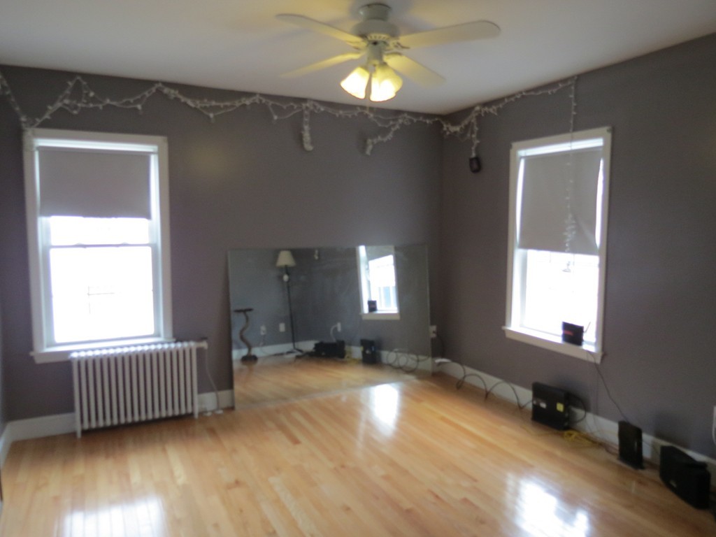 30 Harvard Road Shirley, MA 01464 - Photo 13 of 28 a view of an empty room with wooden floor and a window