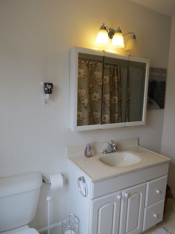 30 Harvard Road Shirley, MA 01464 - Photo 16 of 28 a bathroom with a sink vanity and a mirror